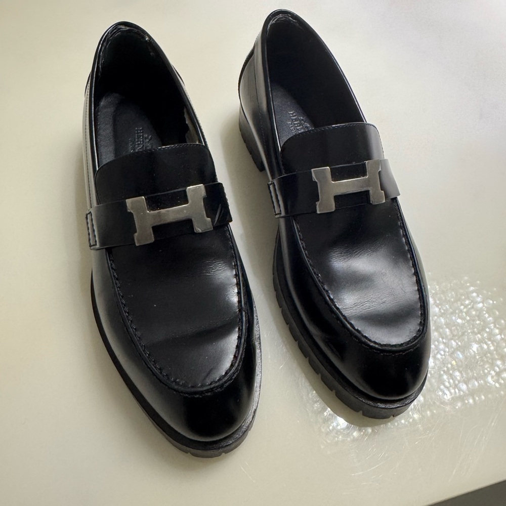 Hermes Faubourg Black Loafers with Metallic Emblem and Glossy Finish - worn once